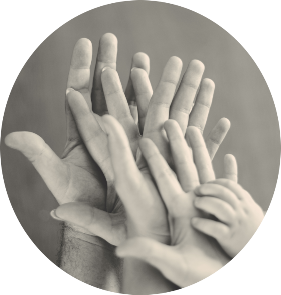 a grey-scale image of five hands held palms outward